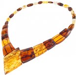 Beads with a combination of dark and light figured amber stones (with a diamond-shaped center)