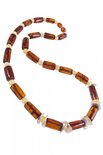 Amber beads with decorative inserts