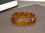 Amber bracelet made of polished cognac plates