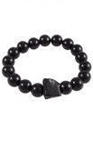 Bracelet made of polished dark amber balls with a stone insert