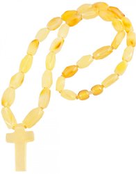Beads made of light multifaceted amber stones with a cross