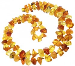 Polished amber stone beads through a knot (long)
