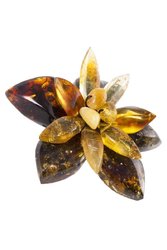 Designer brooch “Flower” made of different sizes of amber stones