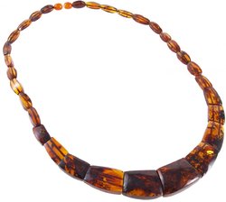 Beads made of figured amber stones of cognac color