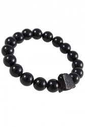 Bracelet made of polished dark amber balls with a stone insert