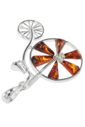 Silver pendant with amber “Penny farthing”
