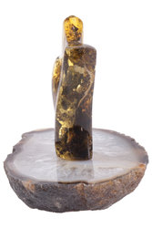 Amber souvenir with inclusion on a stand