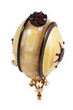 Souvenir egg made of two-color amber plates on a stand