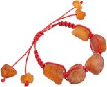 Amulet bracelet with red thread and polished amber