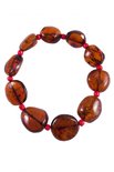 Bracelet made of amber stones-coins with beads
