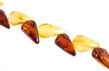 Beads with a combination of light and dark amber “Triumph”
