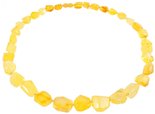Beads made of light multifaceted polished amber stones