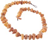 Beads-stones made of polished amber through a knot (medicinal)