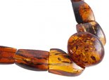 Beads with figured amber stones (with a round center)
