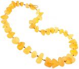 Beads made of polished amber stones on a waxed thread through a knot (medicinal)