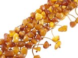 Multi-row braided bracelet made of polished amber stones