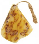 Amber pendant on a wax rope