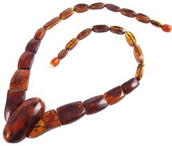 Beads with figured amber stones (with an oval center)