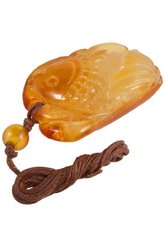 Amber pendant on a wax thread in the shape of a fish