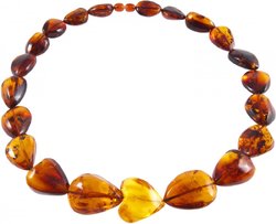 Beads made of amber stones in the shape of heart and drops