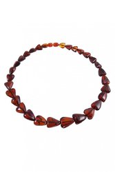 Beads made of dark amber stones in the shape of a heart