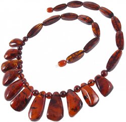Necklace with dark amber pendant stones