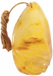 Pendant made of honey amber on a waxed rope