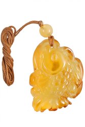 Amber pendant carved in the shape of a fish
