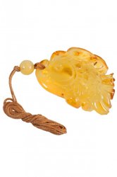 Amber pendant carved in the shape of a fish