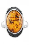 Кольцо из черненого серебра с янтарным кабошоном «Орли»