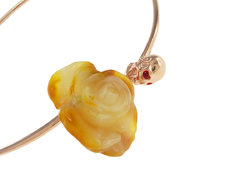 Necklace with amber flower and skull